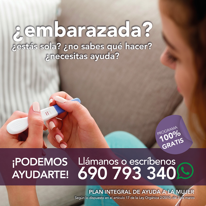 Mujer con test de embarazo positivo. Programa de ayuda a mujeres embarazadas en situación de exclusión social.